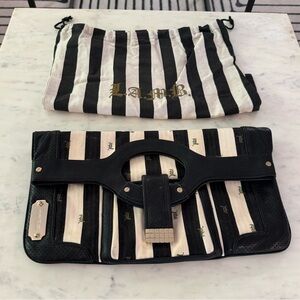 LAMB by Gwen Stefani black-and-white striped fold over clutch